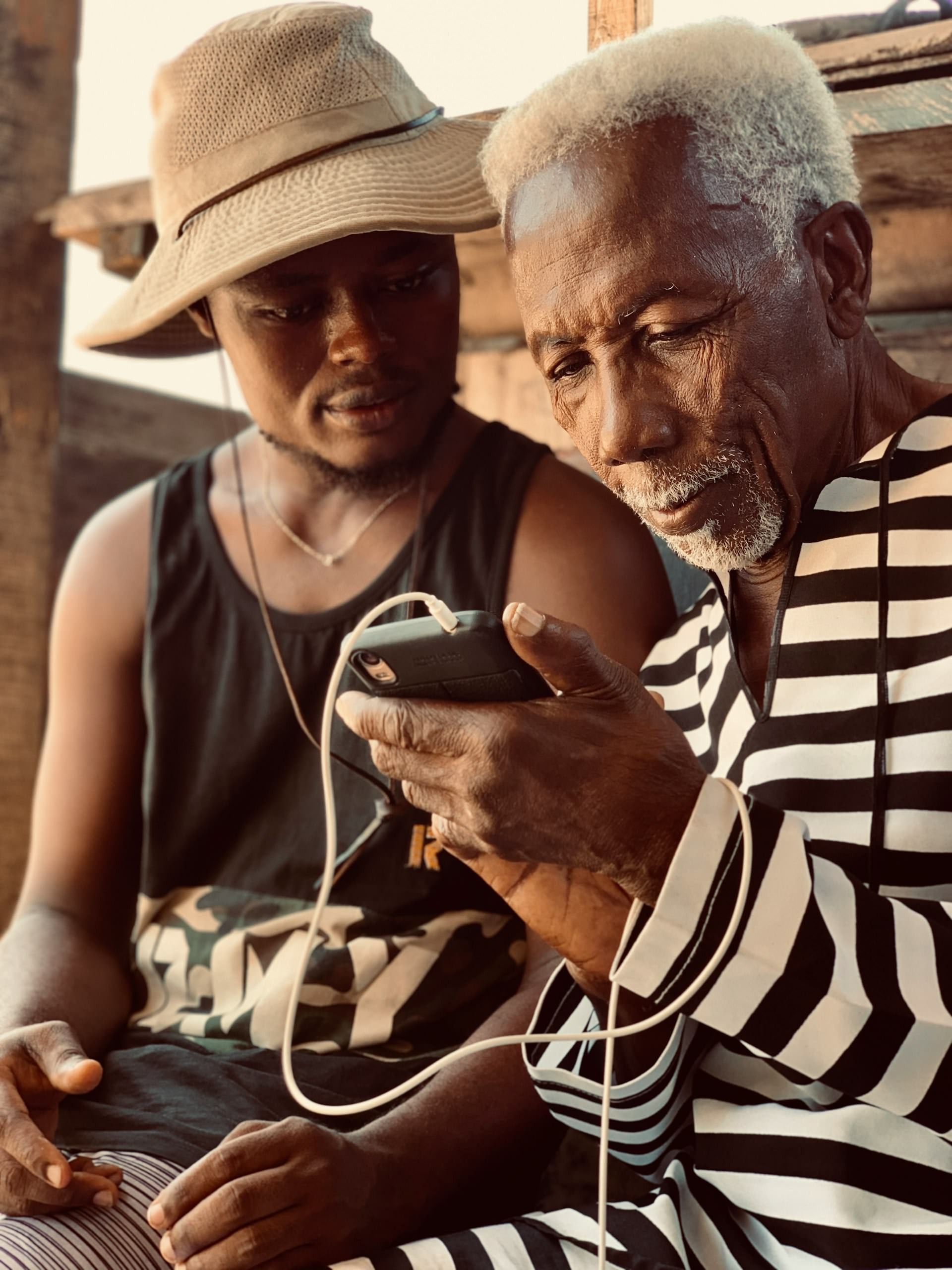 Grandfather and granddaughter looking up