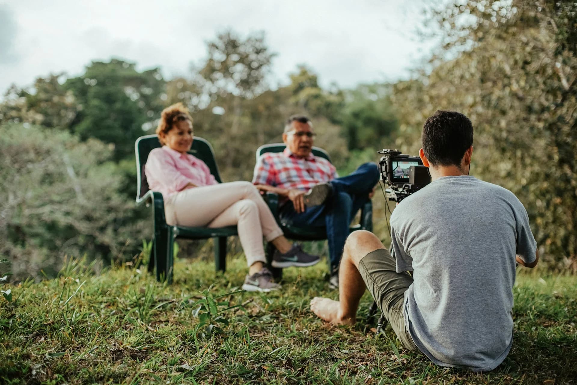 Photo by <a href="https://unsplash.com/@jibarox?utm_source=unsplash&utm_medium=referral&utm_content=creditCopyText">Luis Quintero</a> on <a href="https://unsplash.com/photos/a-group-of-people-sitting-in-chairs-outside-nHbhcirBTOE?utm_source=unsplash&utm_medium=referral&utm_content=creditCopyText">Unsplash</a>
